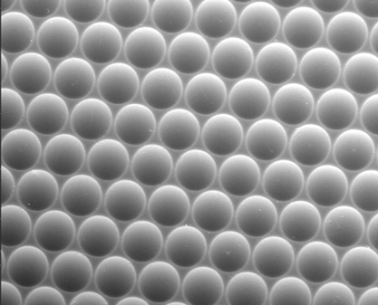 Small grey spheres arranged symmetrically, with a convex appearance.