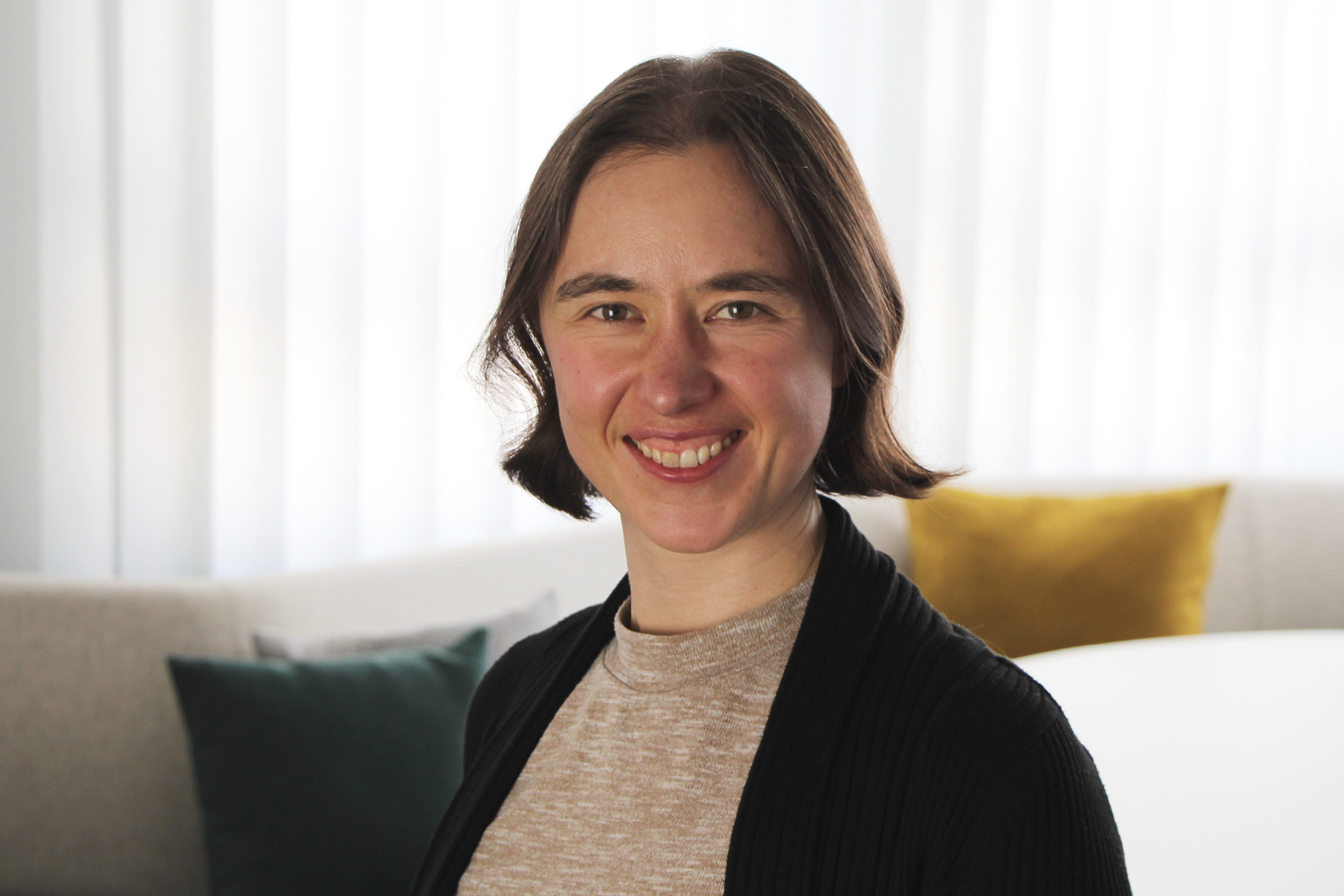 Portrait picture of woman with dark short hair.