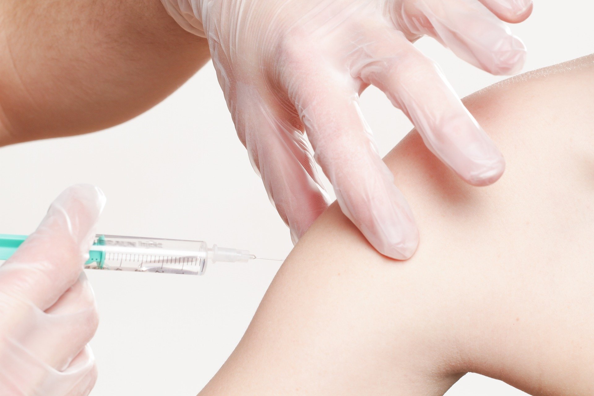 Arm into which a vaccine is injected using a syringe