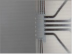 The photo shows a bent circuit board, chip and electronics have adapted themselves to the shape of the board.<br />