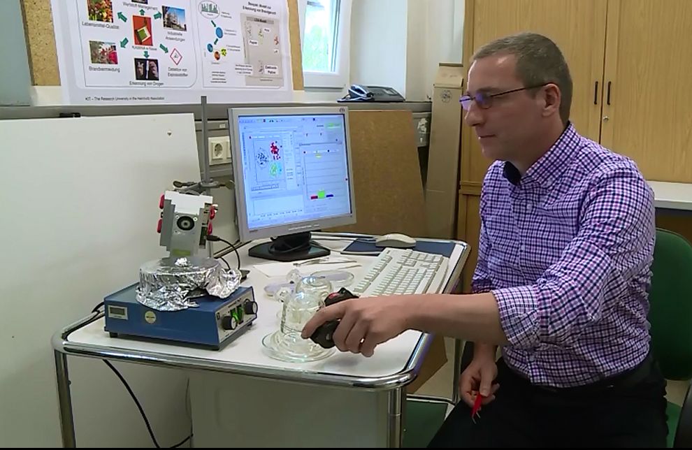 The photo shows the scientist at his workplace