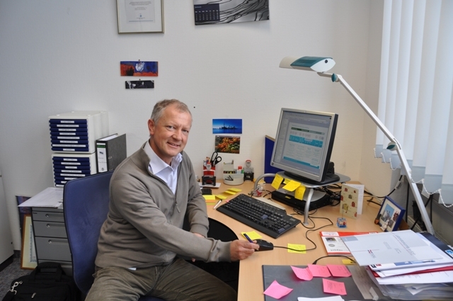 Martin Elmlinger at his desk in his office.