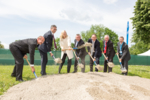Seven people at the groundbreaking ceremony.