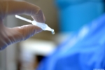 Photo of an ampule from which nano-I-drops drip.