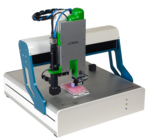 The photo shows the device described in the text. It is shown pipetting a cell suspension into a microtitre plate with 96 wells.