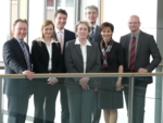 The photo shows 7 staff members of VAXIMM GmbH.
