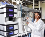 Prof. Mavoungou with a mass spectrometer.