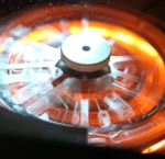 Photo showing a disk-shaped cartridge for use in a point-of-care system.