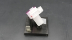 The image shows a plastic valve from the side.