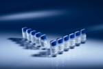 The photo shows vials with caps, arranged in two rows.