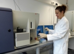 The photo shows Dr. Sommershof in the laboratory, using a flow cytometer.<br />